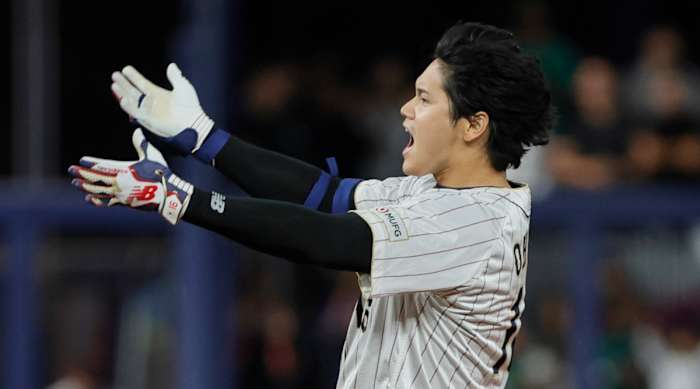 Team Japan DH Shohei Ohtani celebrates after hitting a double during Japan’s ninth-inning rally against Mexico in the WBC semifinals